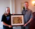 Donna Giberson received a beautiful framed photograph of a green darner dragonfly from outgoing AES President Jon Sweeney, in appreciation of her excellent work organizing the 2004 Joint Annual Meeting of the ESC and AES.  Photo by George Fanjoy. (88kb)